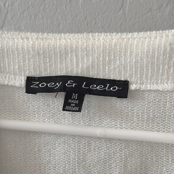 Cute flutter sleeve shoulder white dressy shirt Has a V neck with Diamond accent - Picture 4 of 5